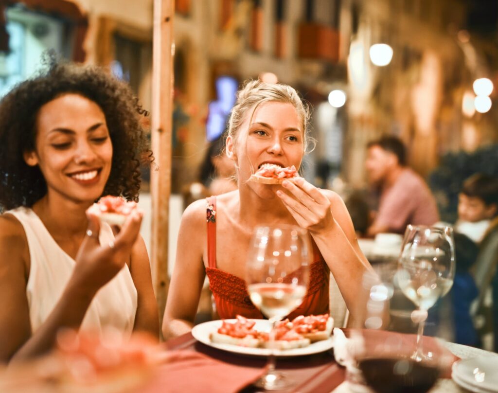 pexels photo 1537635 woman eating bruschetta